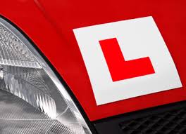 online business v driving instructor - image of L plates on car 